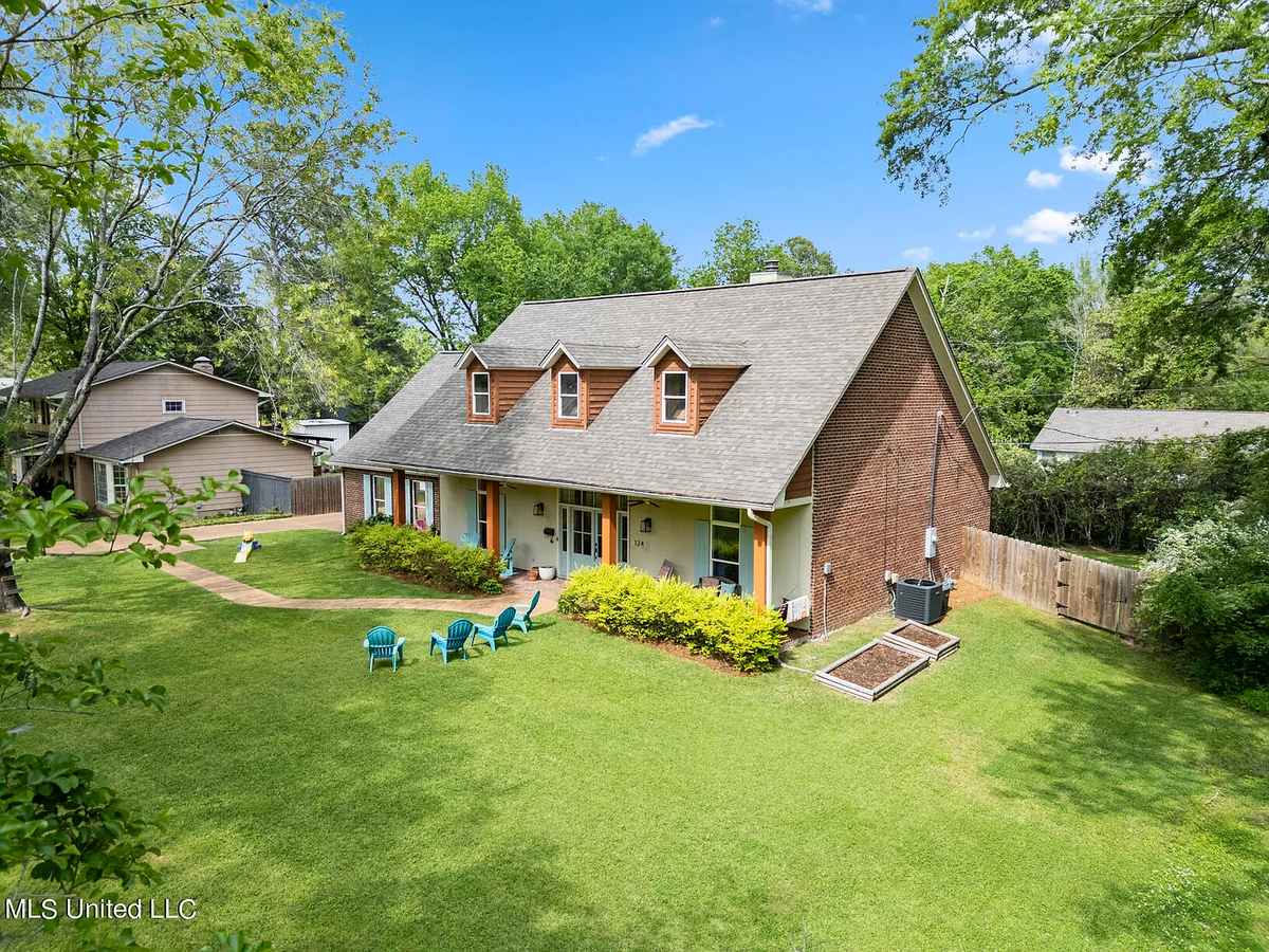 a home with a large yard and a large backyard