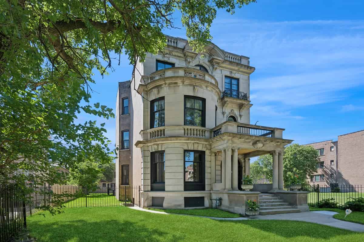 a large house with a large lawn in front of it