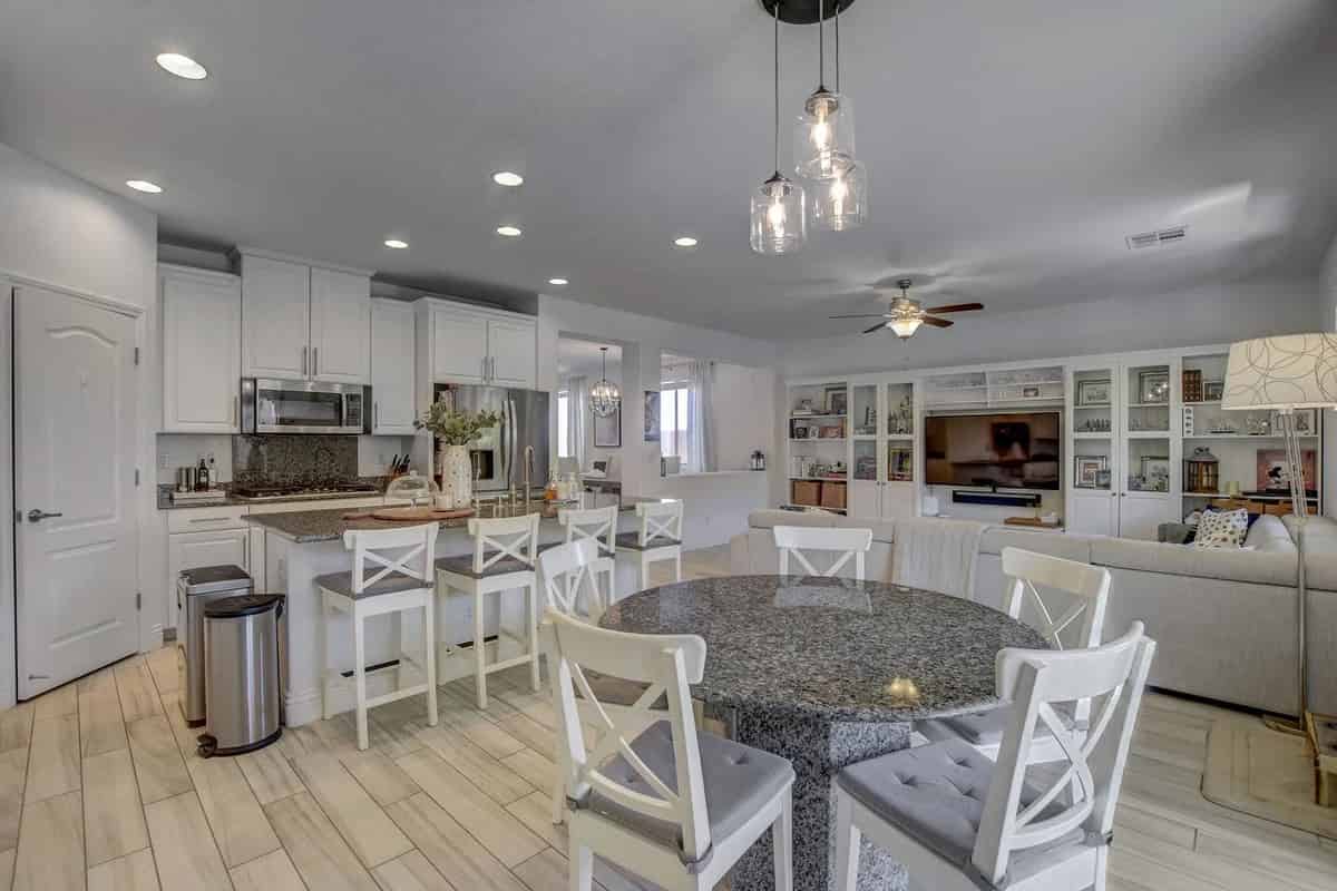 a kitchen and dining area with a table and chairs