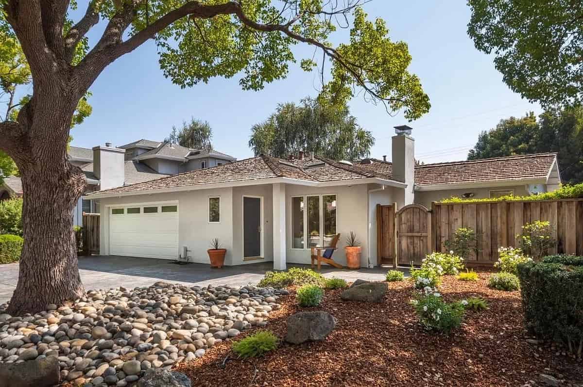 a house with a tree in the yard