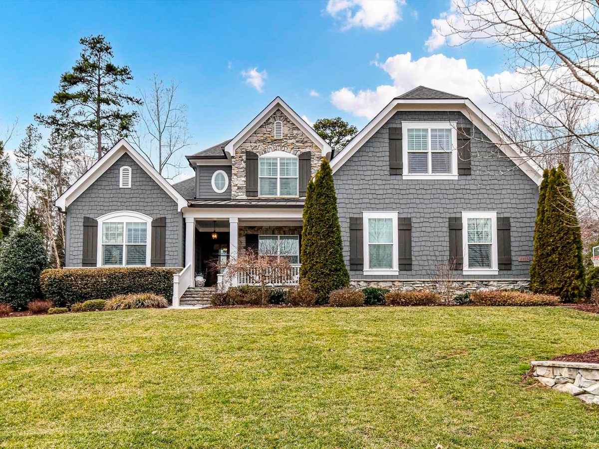 a gray house with white trim and gray shutters
