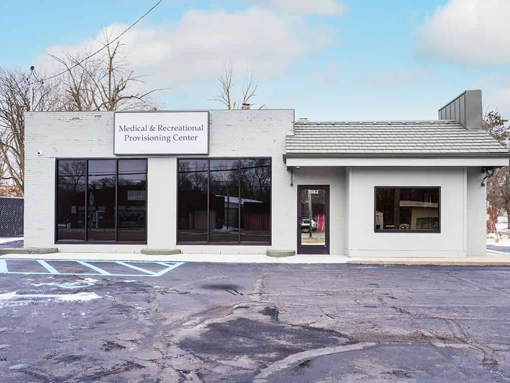 a white building with a sign that says local dental center