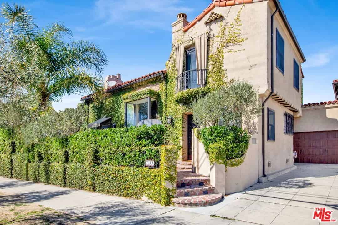a house with a driveway and a driveway leading to the front door