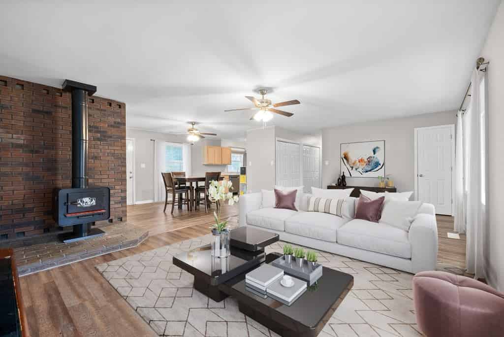 a living room with a fireplace and couch