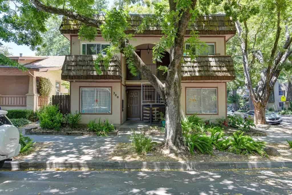 a house with a tree in front of it