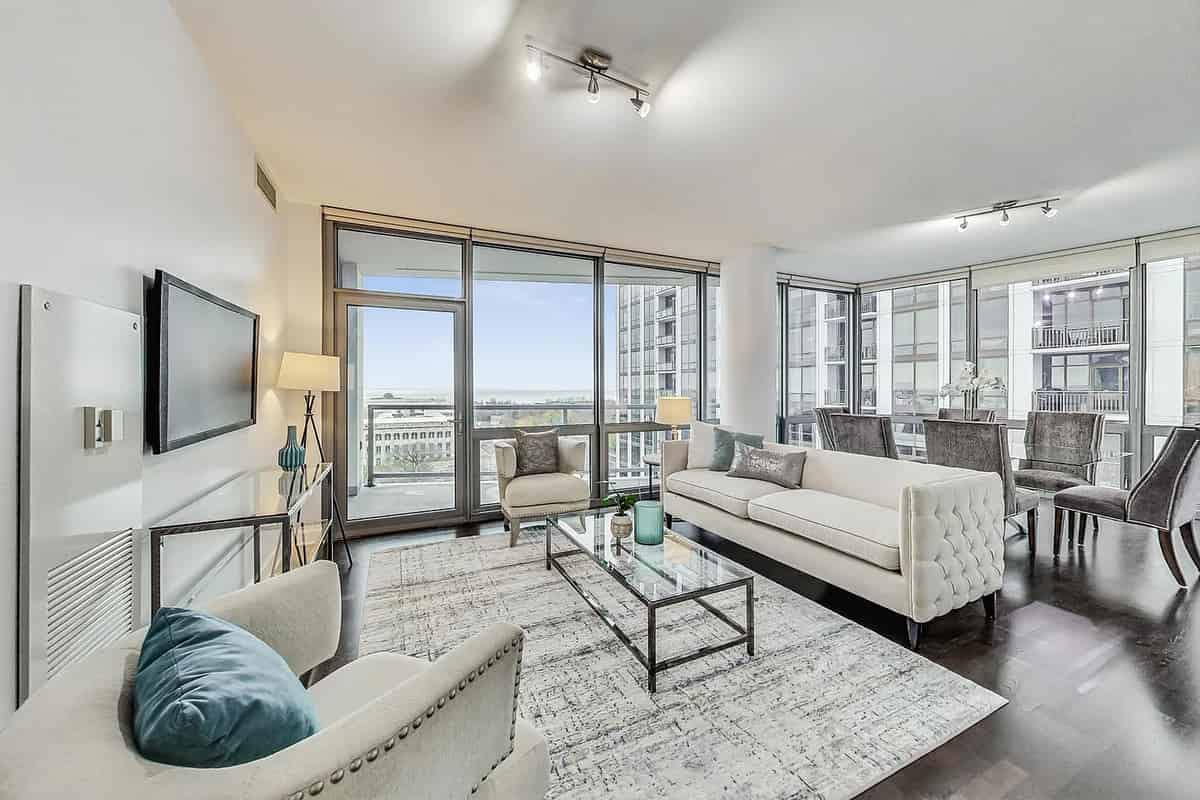 the living room has a large balcony with a view of the ocean