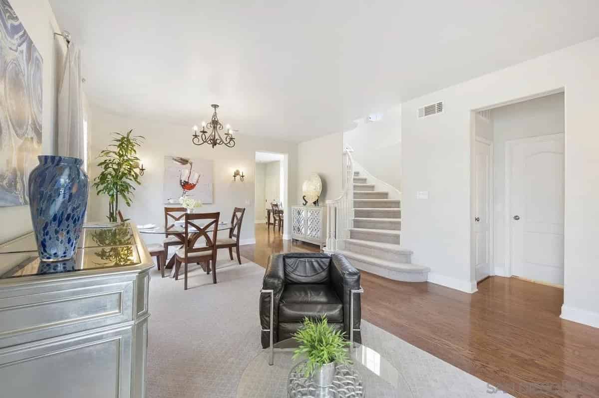 a living room with a couch, chair and a table