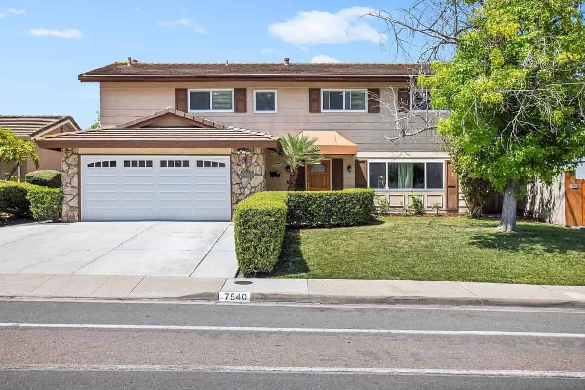 a house with a driveway and a driveway in front of it