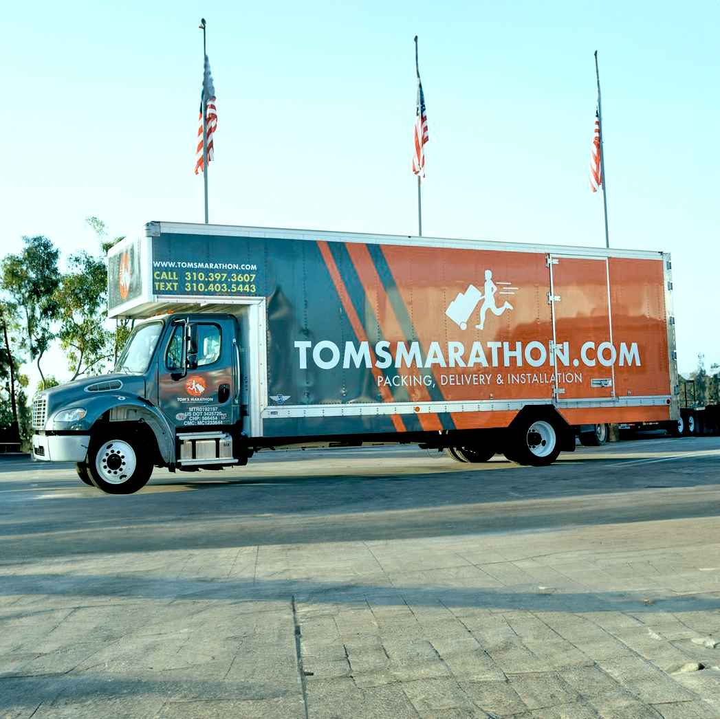 Tom's Marathon Movers LLC logo